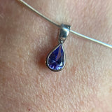 9CT WHITE GOLD PEAR CUT RUBOVER SET TANZANITE PENDANT