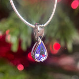9CT WHITE GOLD PEAR CUT RUBOVER SET TANZANITE PENDANT