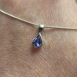 9CT WHITE GOLD PEAR CUT RUBOVER SET TANZANITE PENDANT