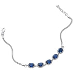 SILVER OVAL BLUE AND WHITE CUBIC ZIRCONIA HALO BRACELET