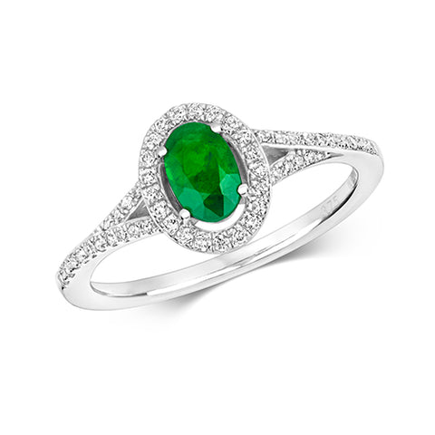 9CT WHITE GOLD OVAL EMERALD AND DIAMOND HALO RING WITH DIAMOND SPLIT SHOULDERS