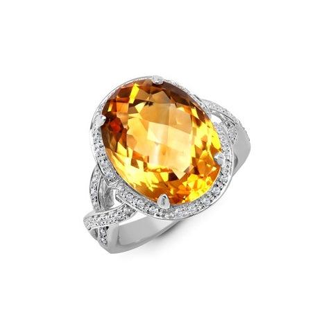 OVAL CHECKERBOARD CUT CITRINE WITH A DIAMOND HALO AND CROSSOVER DIAMOND SHOULDERS. STATEMENT COCKTAIL RING.